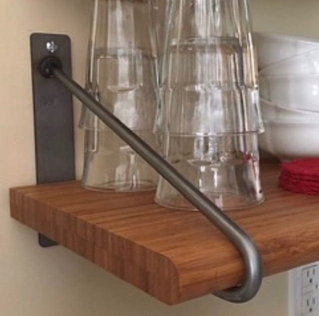 Close up view of a two rod hairpin shelf bracket with wood shelf